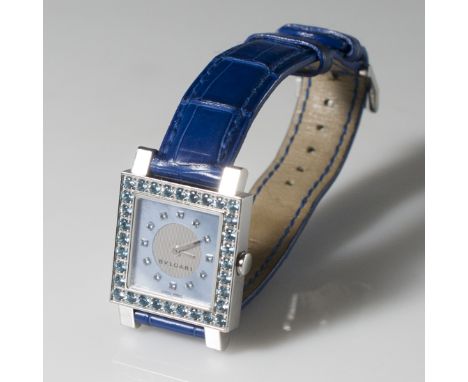 DESCRIPTION:A Bvlgari "Quadrato" Ladies watch. Features a mother of pearl face with diamond dials. Border of case is embellis