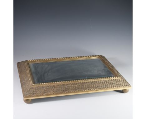 DESCRIPTION: A carved, gilded wood, mirrored tray with carved spiraled embossed design aloong with spherical buttons borderin