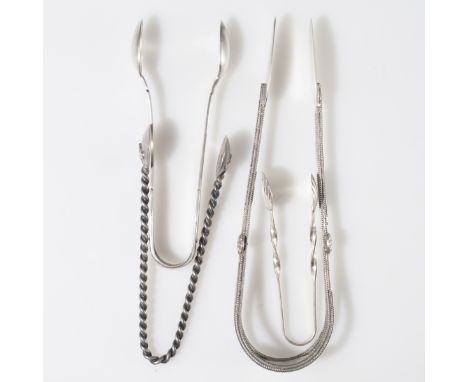 DESCRIPTION: Antique silver and sterling tongues. The first is sterling and features cabled handles with rosettes and is mark