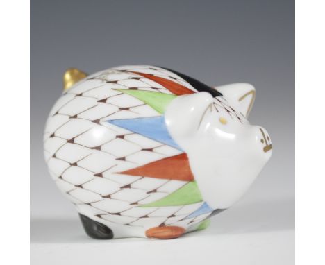 DESCRIPTION: Hollohaza handpainted porcelain pig. Features a maroon hued fishnet pattern with multicolored accents and gilded