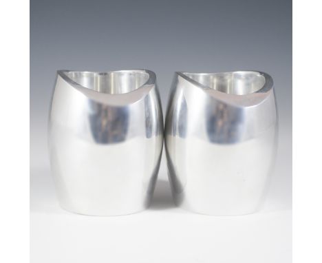 DESCRIPTION: Heavy metal Nambe Studios candlesticks. Features a sleek modernistic design with wave worm edgework and marked:"