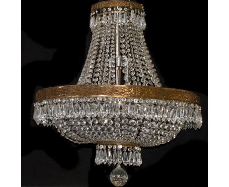 DESCRIPTION:Exquisitie Chandelier featuring a brass frame work embossed, textured designs and strings of faceted crystal bead