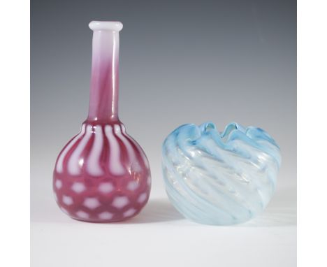 DESCRIPTION: Lot of two glass vases. One features a ruby red hue with spiraling milky white accents and slim tapered neck. Th