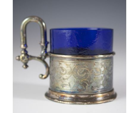 DESCRIPTION: Antique Fraget silverplated chalice. Features an elegant arching handle decorated with rosettes and engraved alo