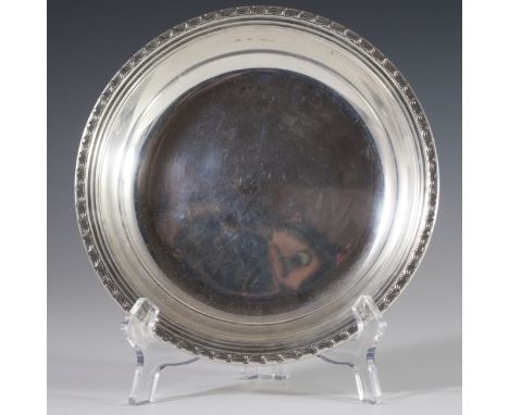 DESCRIPTION: Sterling bowl embellished with embossed rolling designs and ridged borders. Marked:"Sterling" along with an ille