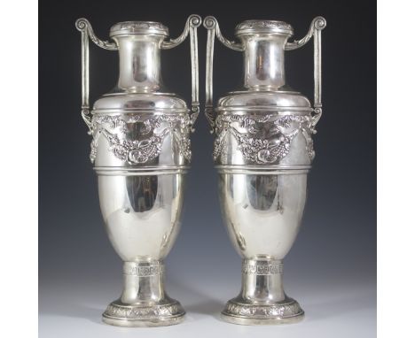 DESCRIPTION: Silverplated vases by Lenk. Features repousse strings of blooming flowers, grape vlusters, and tied fringed ribb