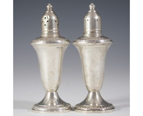 DESCRIPTION: Empire weighted sterling salt and pepper cellars. Features elegant ridged designs as well as a glass interior. M