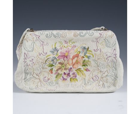 DESCRIPTION: Vintage nightbag featuring woven strings of beads into a floral multicolored pattern. Opens to reveal satin inte