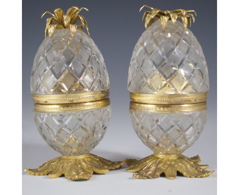 DESCRIPTION:Pair of L. Seiler crystal and dore metal lighters. Features a pineapple shape casing of diamond cut Sevres opalin
