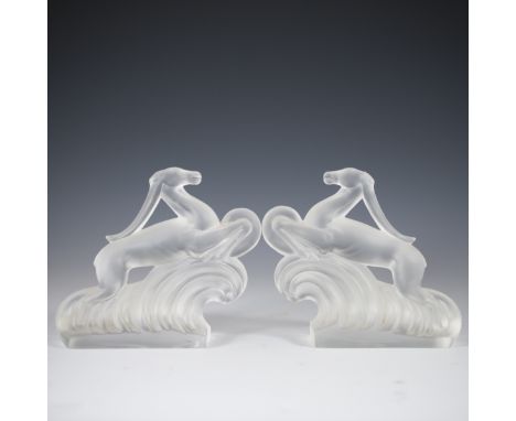 DESCRIPTION: Steuben crystal bookends in the motif of gazelles running through rolling floiage base. Finished with a matted, 