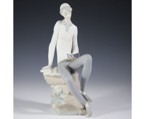 DESCRIPTION: Lladro porcelain figurine titled:"The Hebrew Student". Features a young boy wearing a skullcap, reading Hebrew b