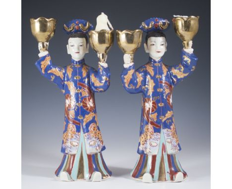 DESCRIPTION: Pair of vintage Japanese Imari style porcelain candlesticks. Features two women holding gilded blossom motif can