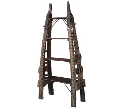 DESCRIPTION: An antique oriental shelving unit comprised of arching wooden horn formlegs that arch alongthe sides flanking th