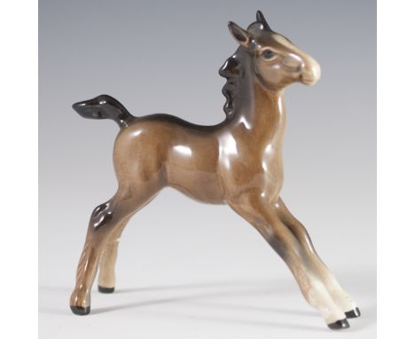 DESCRIPTION:Beswick porcelain figurine of an infant horse. Handpainted in a brown hue and finished with a glossed glaze. Mark