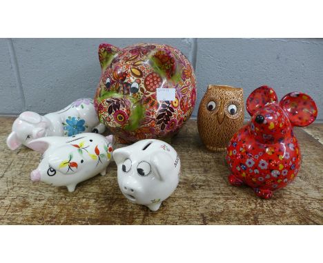A collection of vintage money boxes including Wade and Pomme Pidou **PLEASE NOTE THIS LOT IS NOT ELIGIBLE FOR IN-HOUSE POSTIN