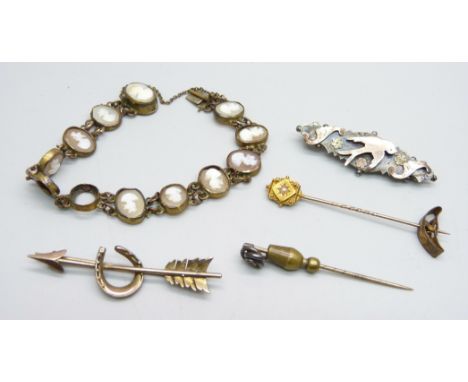A 15ct gold stick pin with inset pearl, a cameo bracelet, gold on silver brooch and one other brooch, bracelet lacking one ca