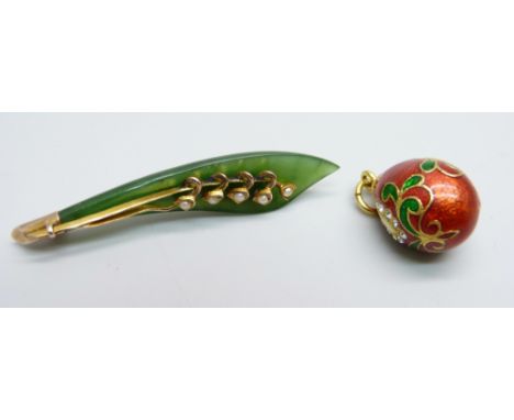 A jade brooch set with seed pearls in a yellow metal mount (tests as 9ct gold, base metal pin) together with a yellow metal, 