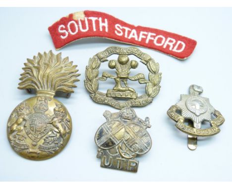 Four military badges and a South Stafford uniform arm patch 