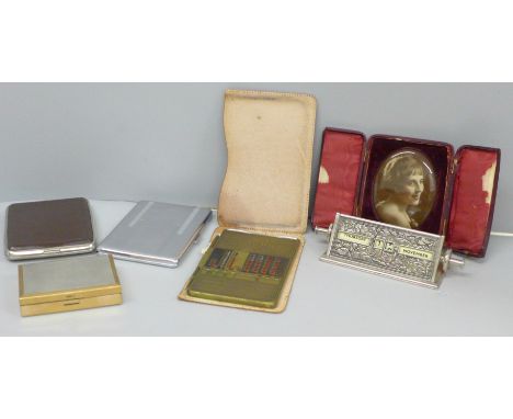 Two cigarette cases, desk calendar, a Duplex Addiator, a plated musical compact and a cased portrait plaque 