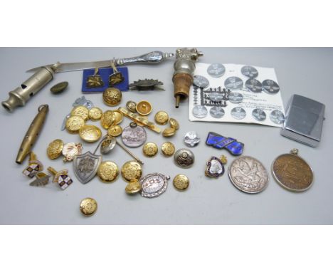 A collection of military uniform buttons, a silver football medal, Durham Light Infantry lighter, a 1935 crown, a Trans Alask