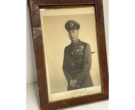 WILDING (Wilding) portrait photograph of King George VI in RAF uniform and with a baton under his arm, signed below in ink "G