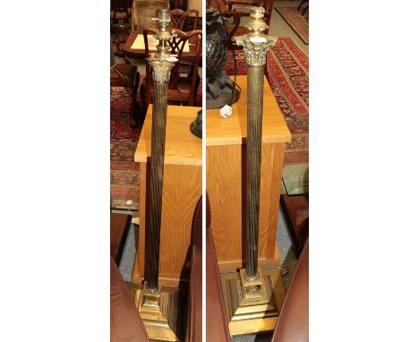A brass standard lamp of reeded Corinthian column form over a square stepped base together with a similar example, tallest 12