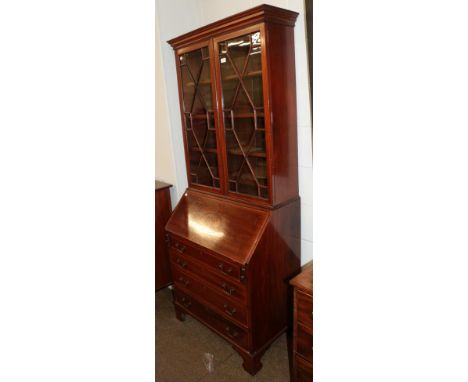 An Edwardian mahogany bureau bookcase, with astragal glazed top section, cross banded in satinwood, marquetry inlaid fall and