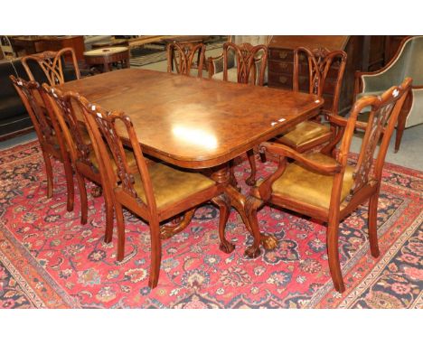 A burwood pedestal dining table 210cm by 110cm by 77cm together with a set of eight chairs including two carvers .  The top w