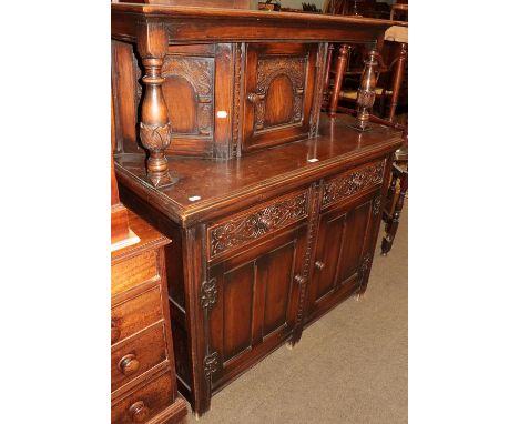 A 20th century carved and panel-oak court cupboard, 118cm by 53cm by 140cm 