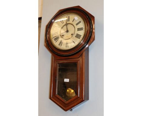 An early 20th century Ansonia mahogany veneered drop-dial wall clock with painted dial and striking on a gong, 80cm.  Case wi