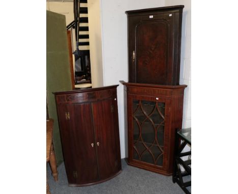 A George III mahogany astragal glazed hanging corner cupboard, 62cm by 50cm by 110cm together with an early Georgian mahogany