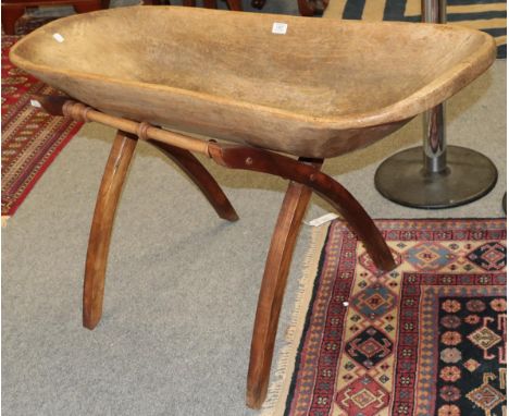 An 18th century dough trough on associated later stand, trough 110cm by 44cm by 20cm 