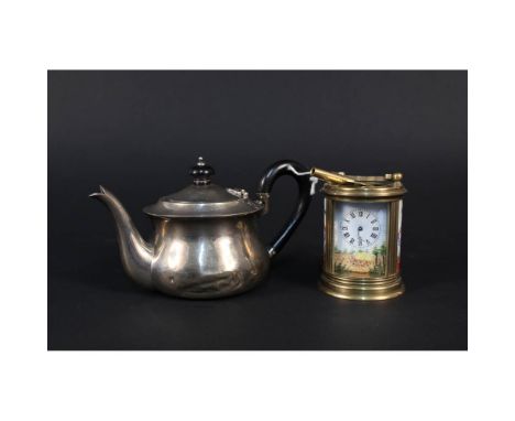 A small silver teapot (as found) plus a brass and porcelain miniature clock (as found)