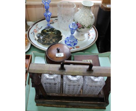 A three bottle Tantalus (no stoppers), a tea caddy and a biscuit barrel, a 19th Century stone china meat plate plus other chi