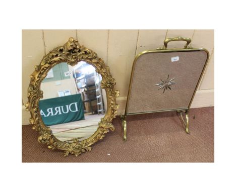 A brass and mirror glass fire screen plus a gilt wall mirror