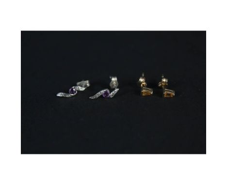 A pair of 9ct white gold amethyst and diamond earrings plus a pair of 9ct gold citrine set earrings