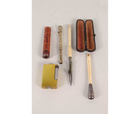 A cigarette lighter, cheroot holders etc