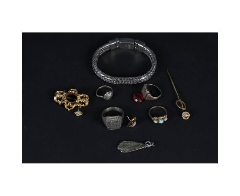 A quantity of silver and white metal jewellery including rings and bracelets together with a yellow metal brooch and a yellow