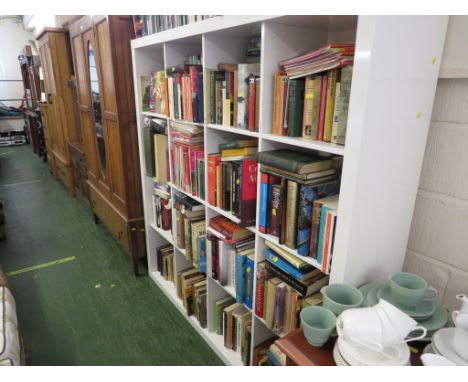 LARGE OPEN SHELF UNIT OF SIXTEEN SHELVES IN A GLOSS WHITE FINISH .
