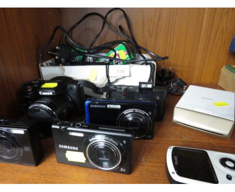 THREE SAMSUNG DIGITAL CAMERAS , TWO CANON DIGITAL CAMERAS , KODAK CAMERA , TOGETHER WITH SOME CHARGERS AND ACCESSORIES.