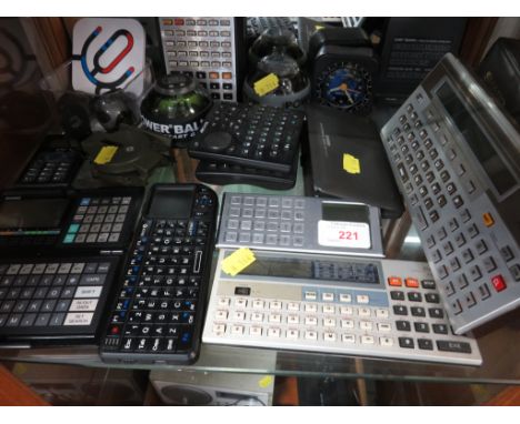 A SELECTION OF VINTAGE CALCULATORS INCLUDING CASIO, TOGETHER WITH OTHER ITEMS INCLUDING POWER BALL GYROS (ONE SHELF) (NO MAIN