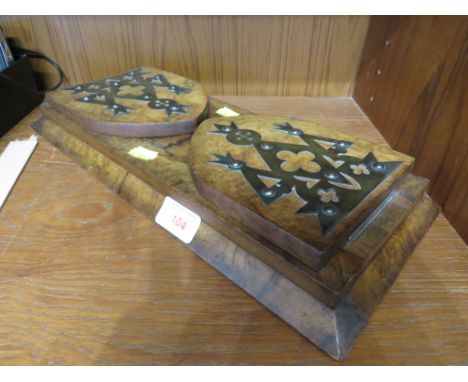 WALNUT VENEERED EXTENDING BOOK SHELF WITH APPLIED BRASS DETAILS.