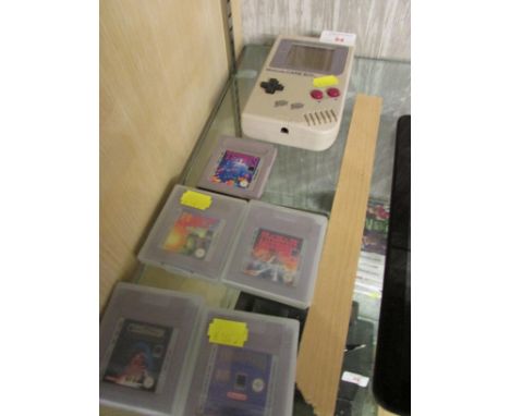 ORIGINAL NINTENDO GAMEBOY CONSOLE. (AF) TOGETHER WITH FIVE GAMES.