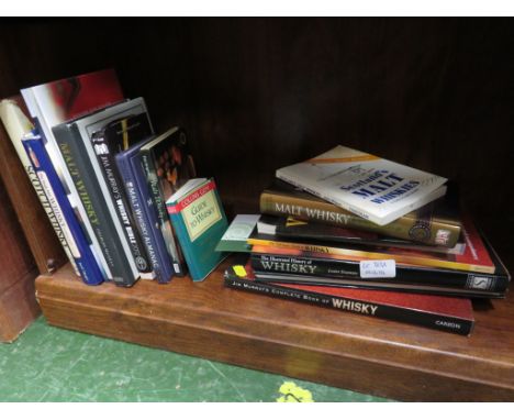 ONE SHELF OF BOOKS ABOUT WHISKEY.