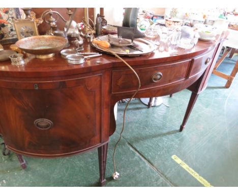 A REPRODUCTION REGENCY BOW FRONT SIDEBOARD , MAHOGANY VENEER WITH EBONY STRINGING, TWO CENTRAL DOORS AND CUPBOARD TO EITHER S