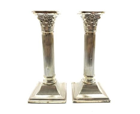 Pair of late Victorian silver Corinthian column table candlesticks with square bases H20cm Birmingham 1898 Maker J Sherwood &