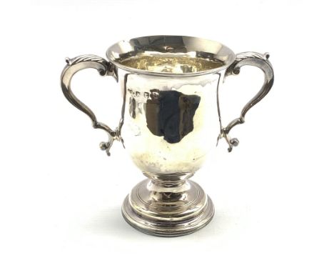 George III silver two handled loving cup of baluster form with leaf capped scroll handles and pedestal foot H14cm London 1817
