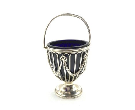 Silver sugar basket, the pierced sides with garlands and tied bows, blue glass liner and short pedestal foot, London 1913 Mak