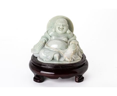 A CARVED JADE FIGURE OF BUDAI
Modelled seated, holding a string of beads and a sack, on wood base
19.5cm high including stand