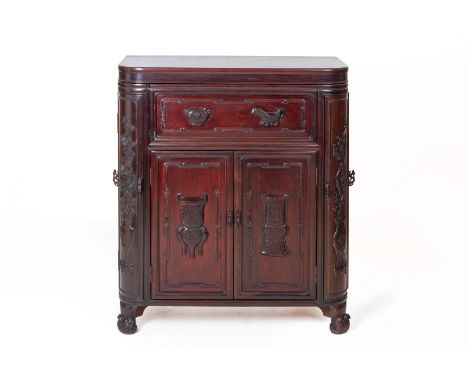 A CHINESE HARDWOOD BAR CABINET
Fitted with two cupboard doors to the front and two to each side of the cabinet, the doors car